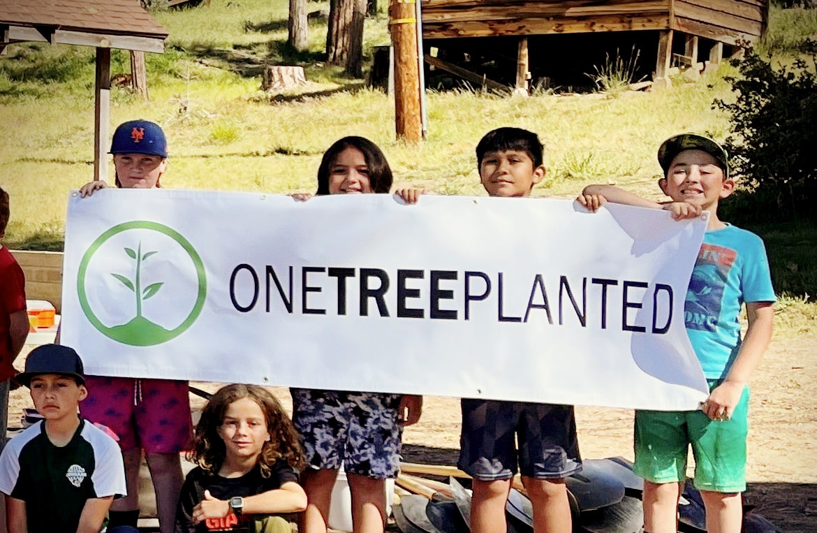 North Fork Elementary Student Volunteers Holding One Tree Planted Banner